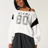 Helppo off-the-shoulder Miami Graphic -huppari Helppo off-the-shoulder Miami Graphic -huppari