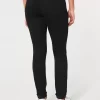 Korkeat revityt mustat Jean-leggingsit Korkeat revityt mustat Jean-leggingsit