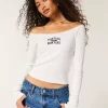 Lace Trim Off-the-Shoulder Montauk Graphic T-paita Lace Trim Off-the-Shoulder Montauk Graphic T-paita
