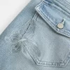 Matalakorkea keskipesu brodeeratut Butterfly Bootcut -farkut Matalakorkea keskipesu brodeeratut Butterfly Bootcut -farkut