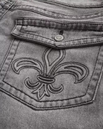 Pestyt mustat brodeeratut Baggy Bootcut -farkut