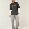 Pestyt mustat koristellut graafiset baggy-farkut Pestyt mustat koristellut graafiset baggy-farkut