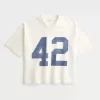 Raskas Baggy Crop Varsity Graphic Football T-paita Raskas Baggy Crop Varsity Graphic Football T-paita