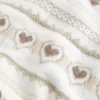 Ylisuuri Heart Pattern Crew -villapaita Ylisuuri Heart Pattern Crew -villapaita