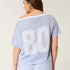 Ylisuuri off-the-shoulder Varsity Graphic Jersey Ylisuuri off-the-shoulder Varsity Graphic Jersey